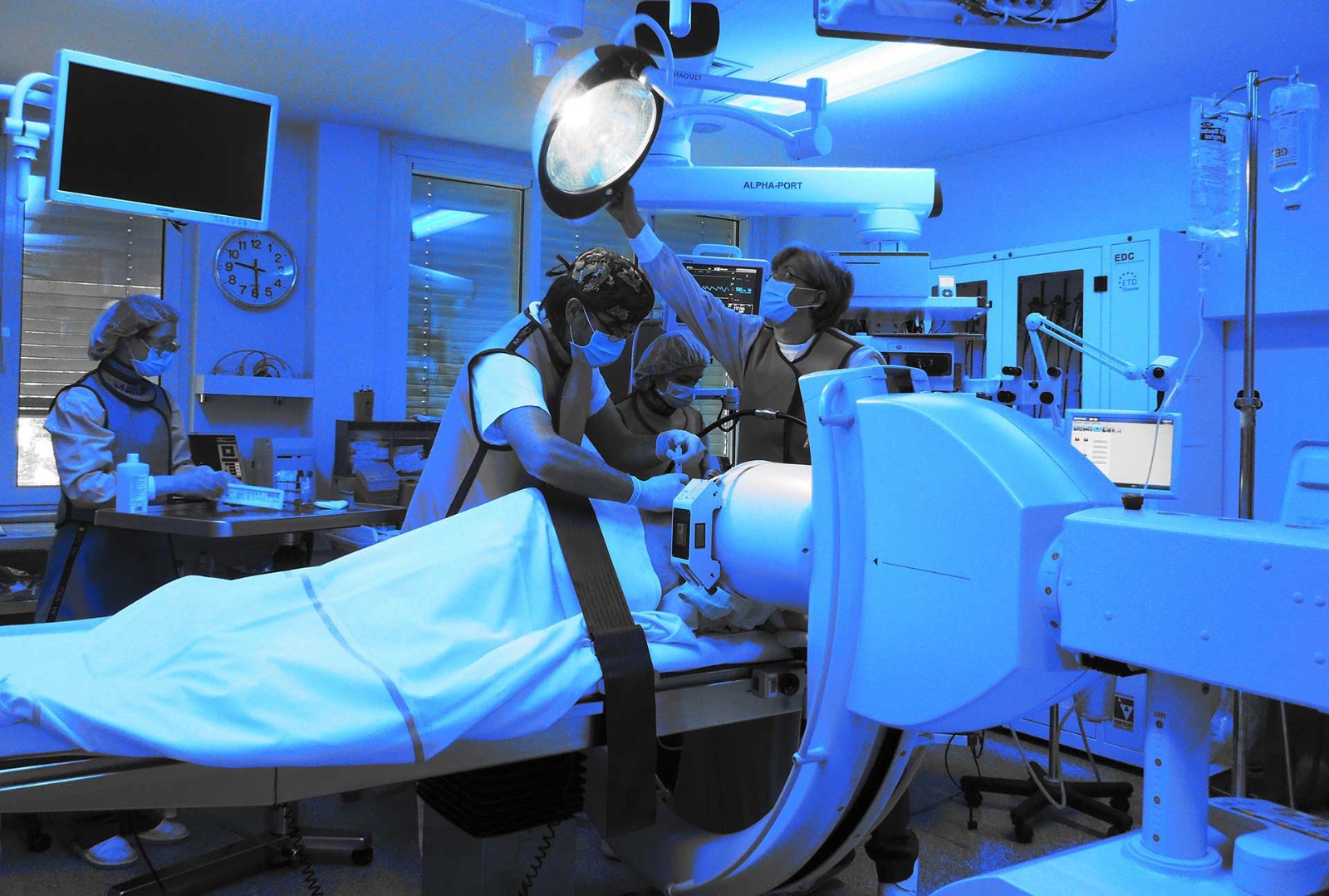 The Golnik team at work under fluoroscopic guidance during an interventional procedure